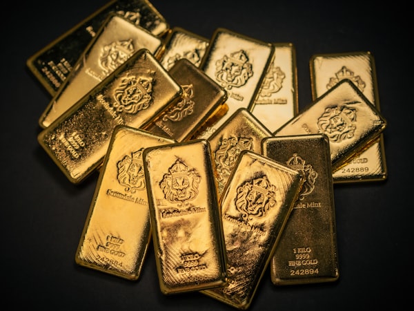 Gold bullion bars on dark background